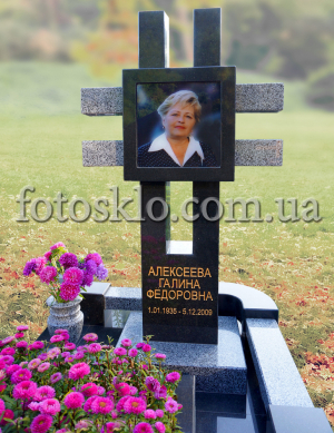 Monument cross made of granite with photo glass